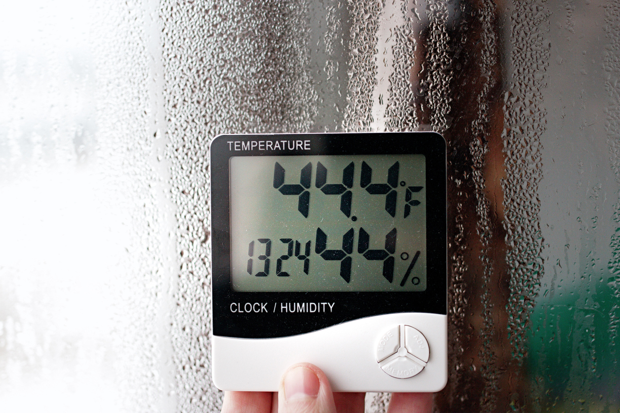 humidity and temperature indicator on window with condensation
