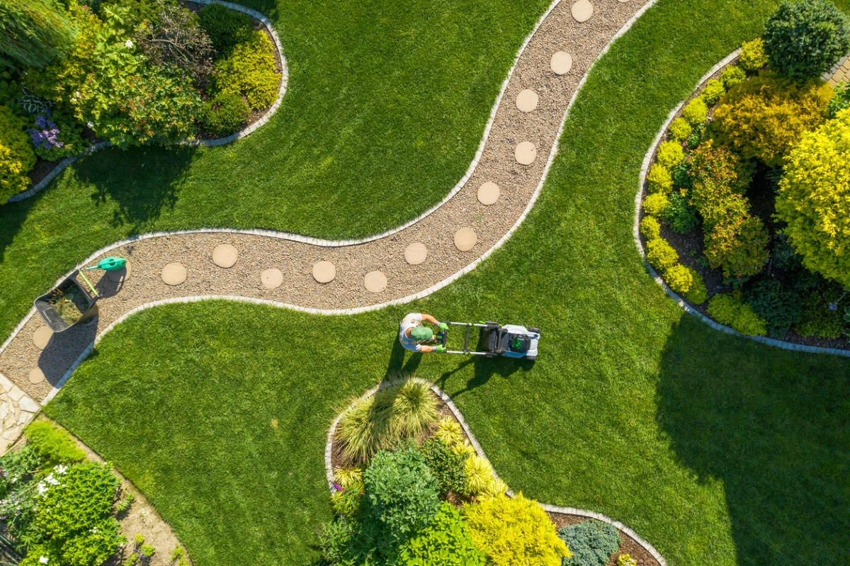 Aerial view of person mowing lawn