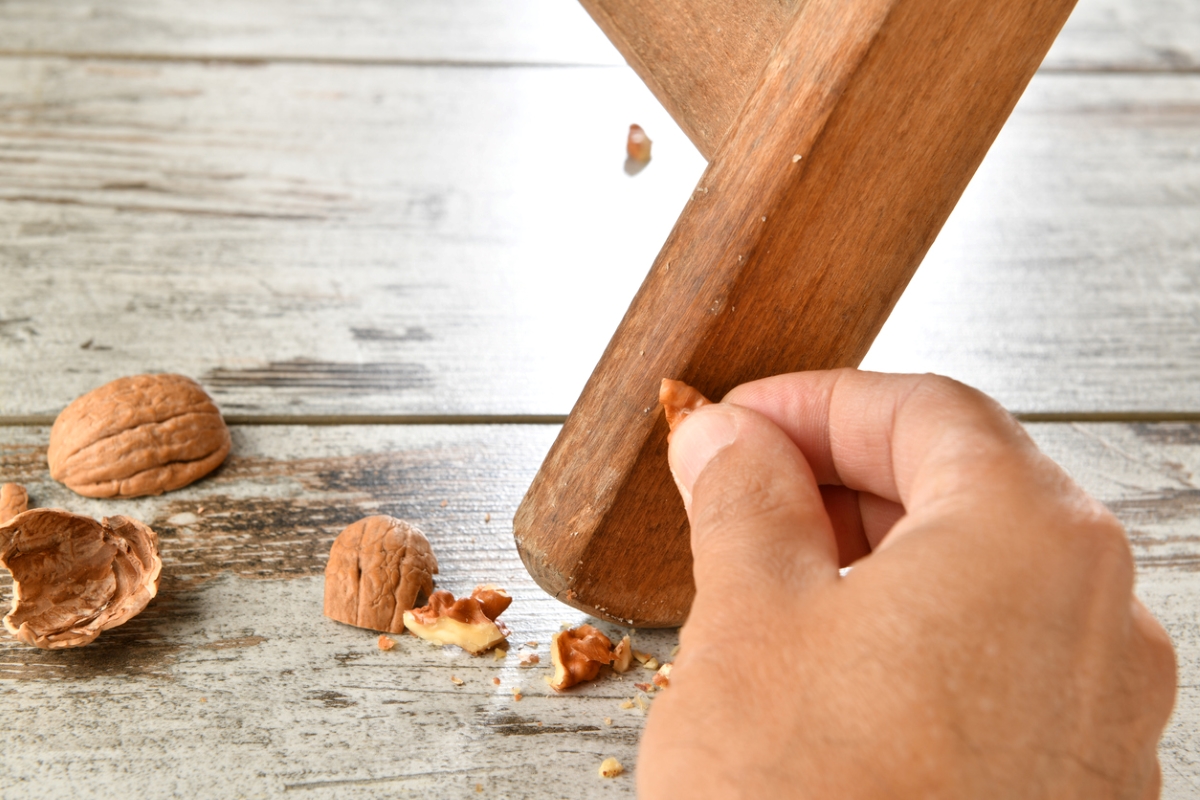 Using walnut to clean wooden chair leg