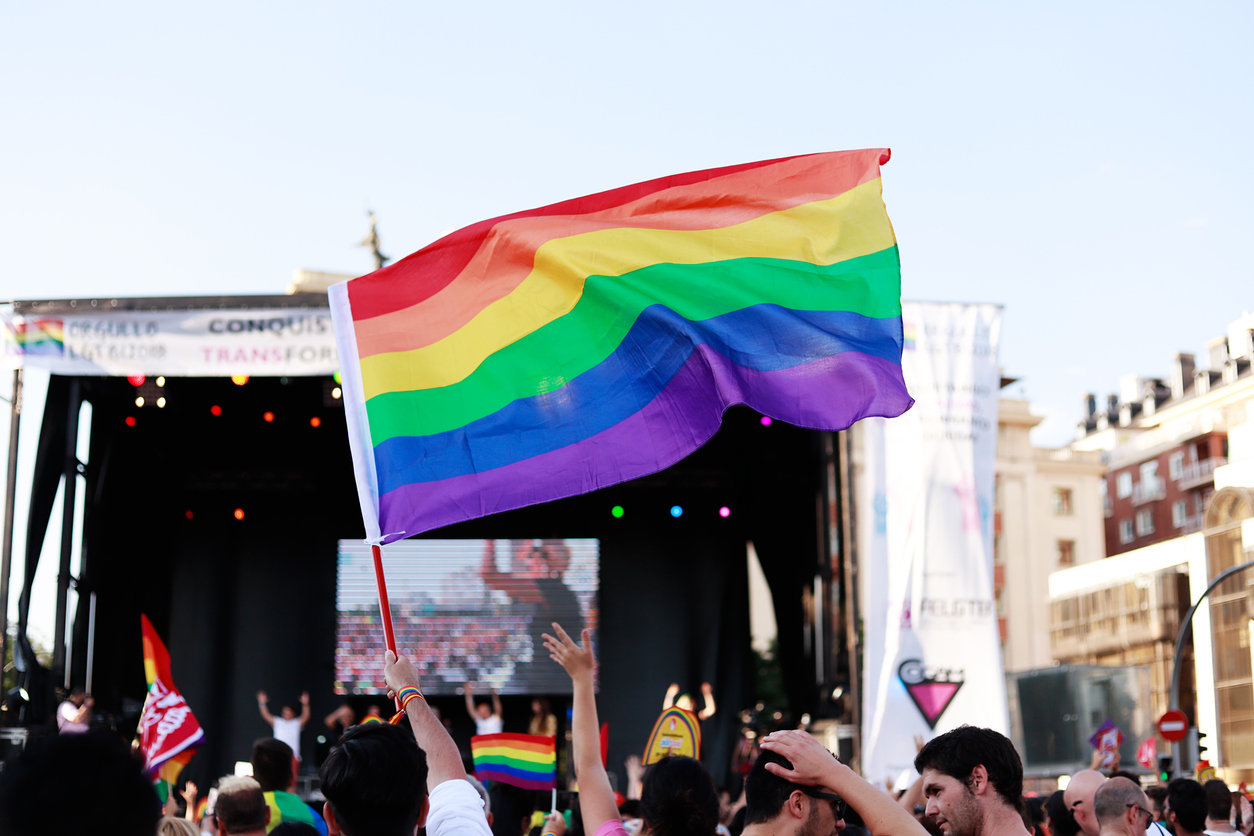 Rainbow flag waved in front of a concert on Gay Pride Day