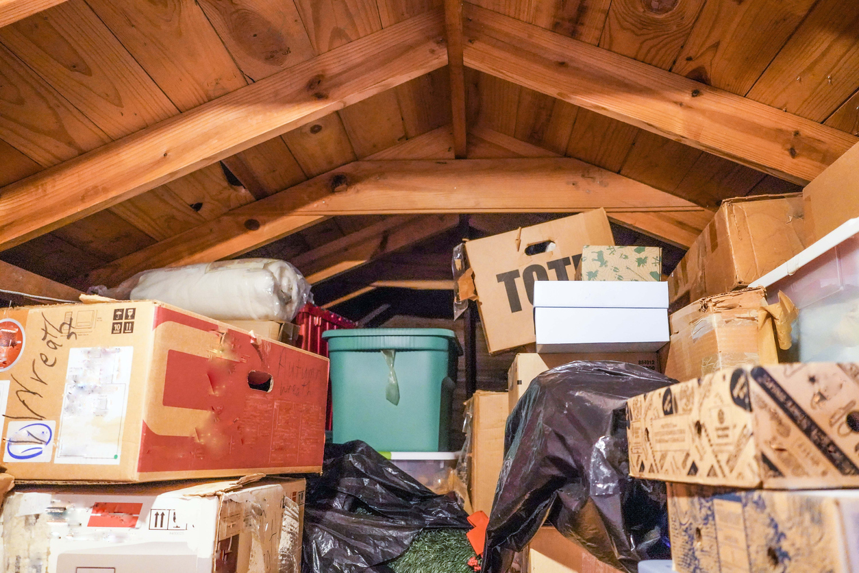 attic space filled to the ceiling with boxes in storage
