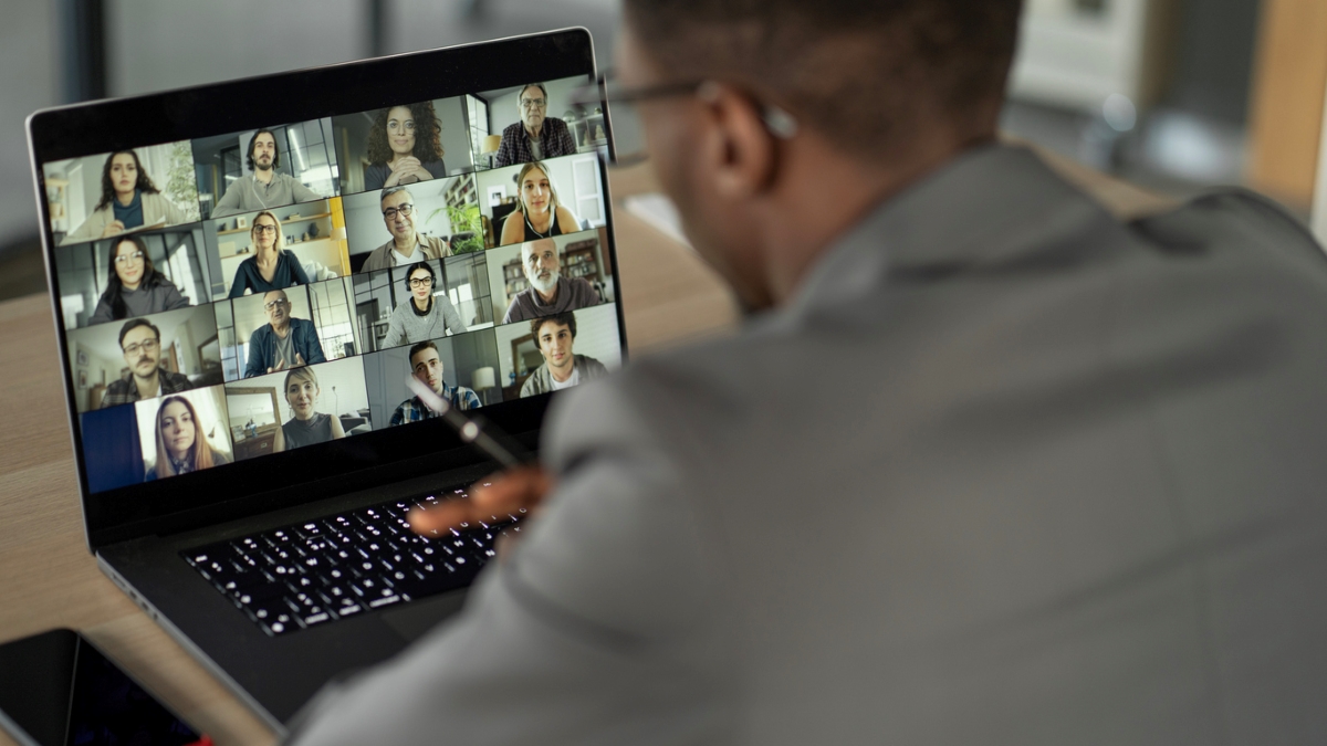 Man on zoom meeting with multiple people
