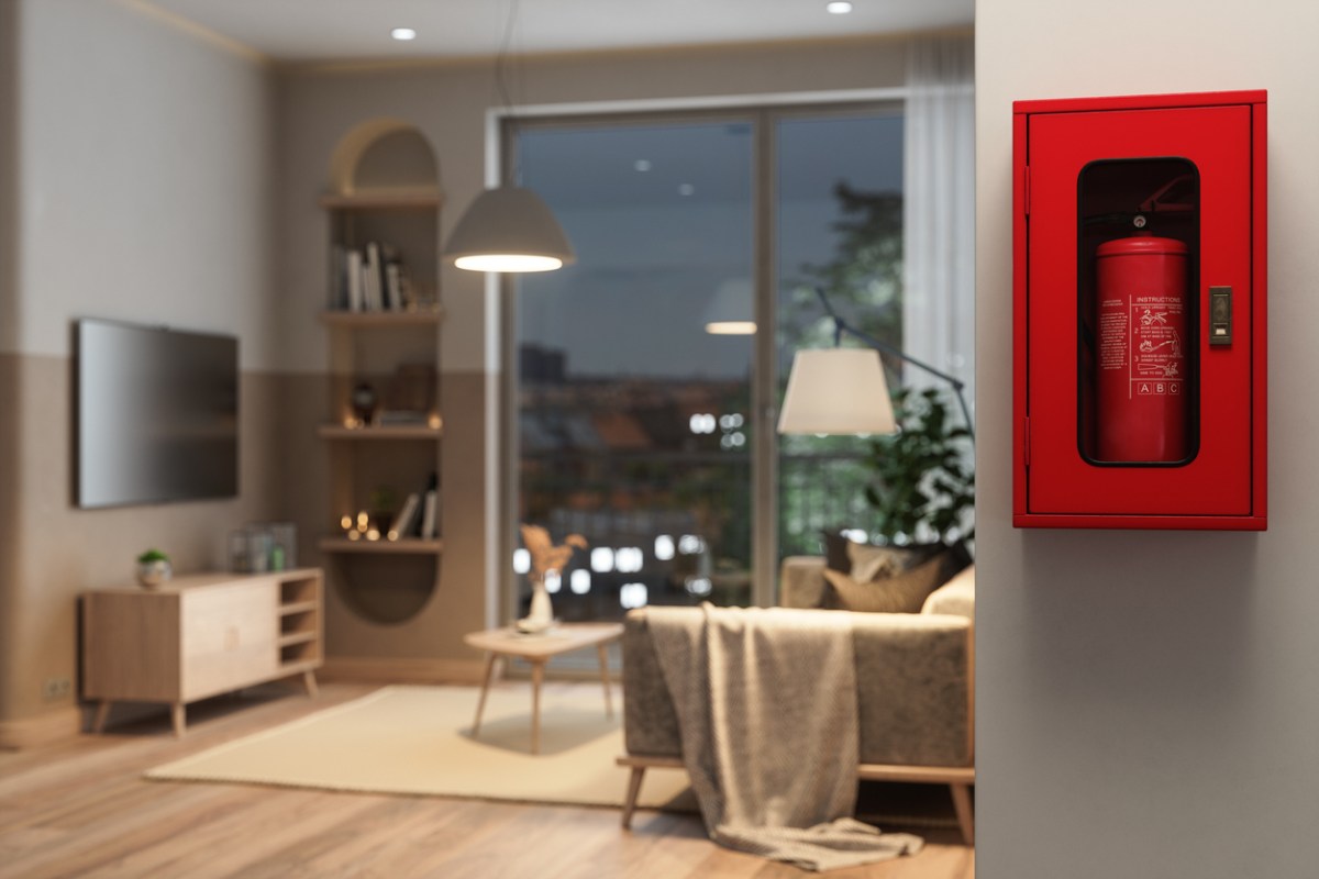 a fire extinguisher mounted on the wall in a hallway with view into cozy living room space