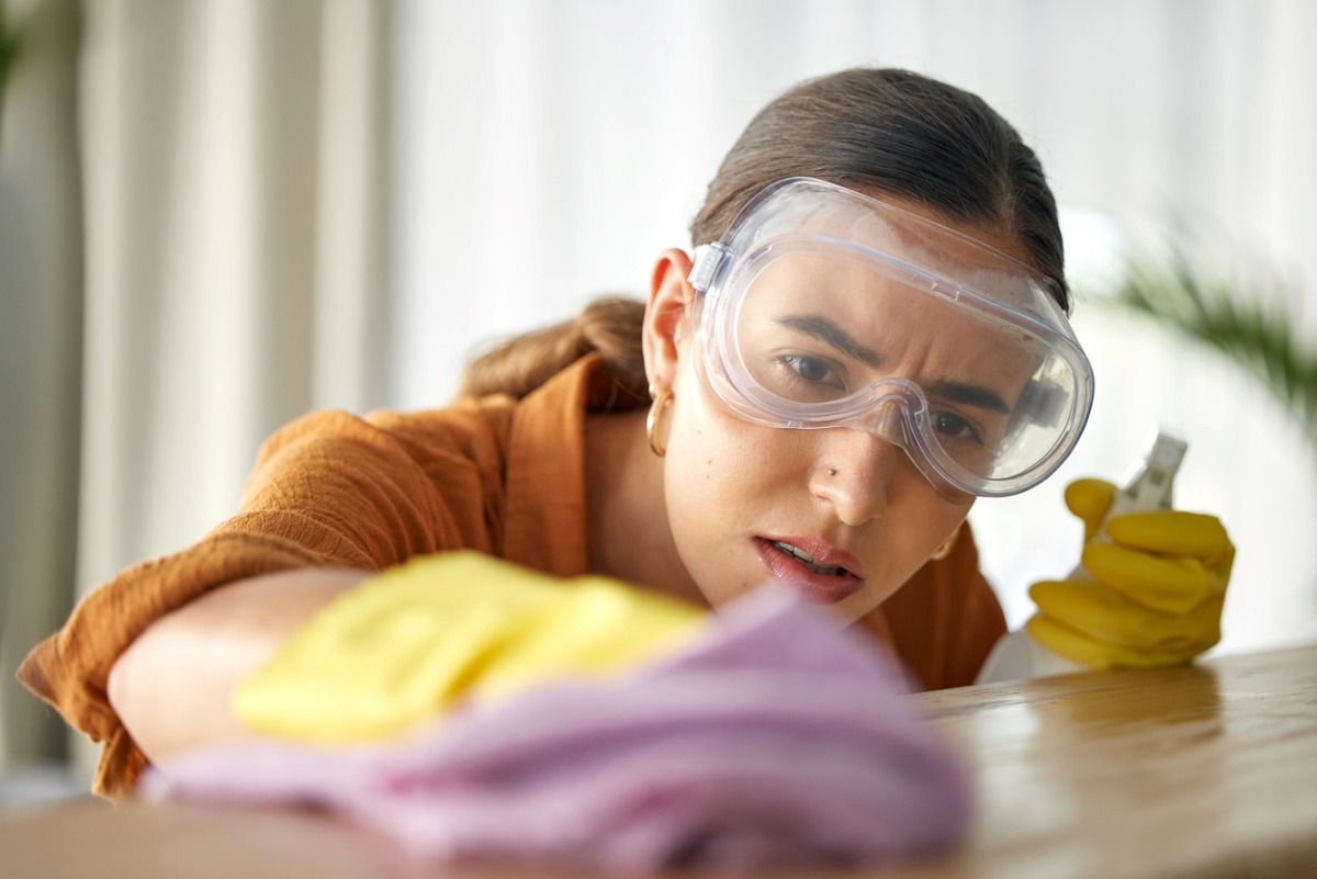 Woman wearing PPE to clean