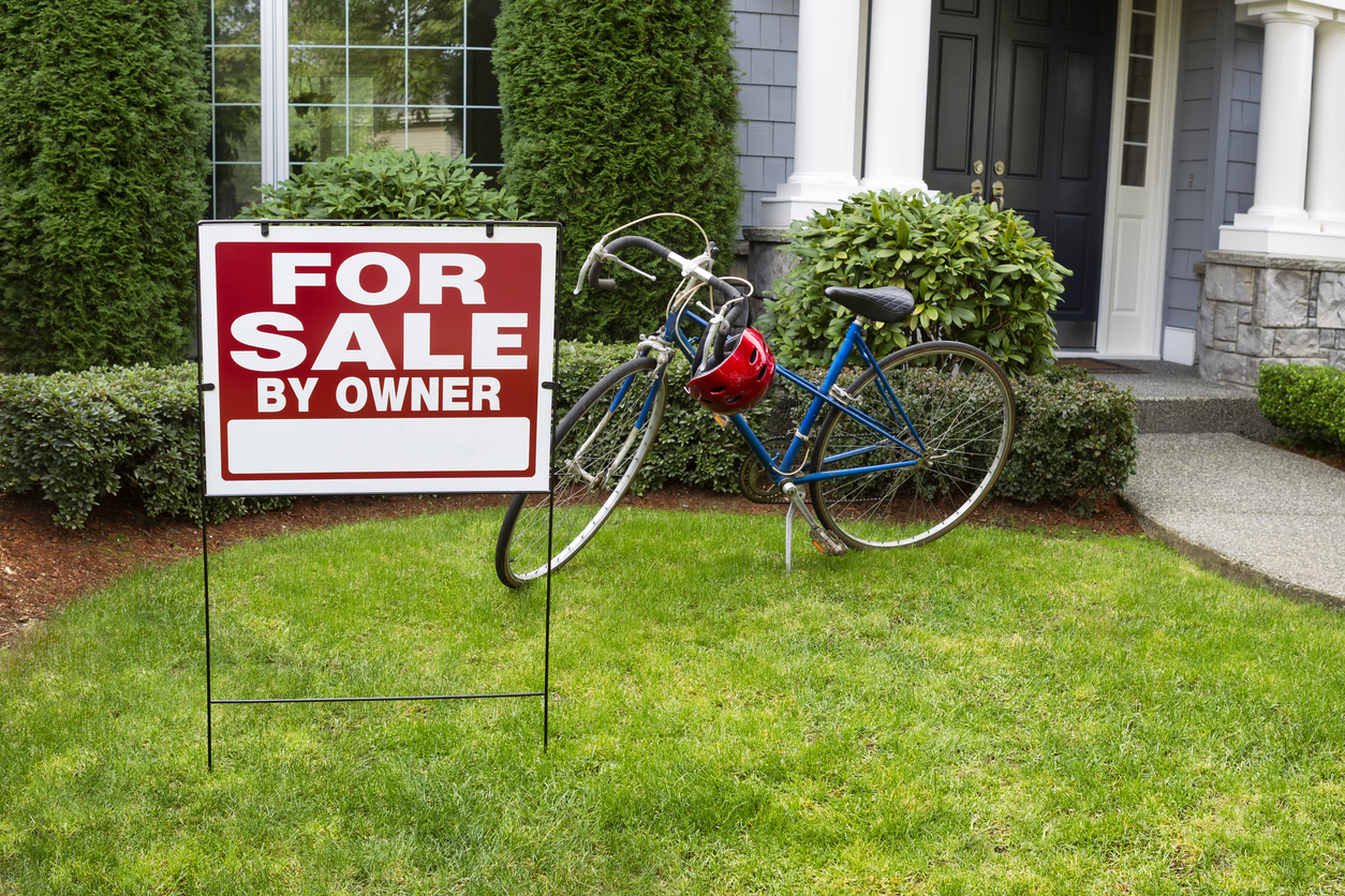 for sale by owner sign in front of house with bike in the front yard