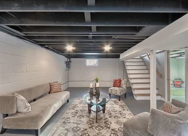 Basement with blue gray painted rafters