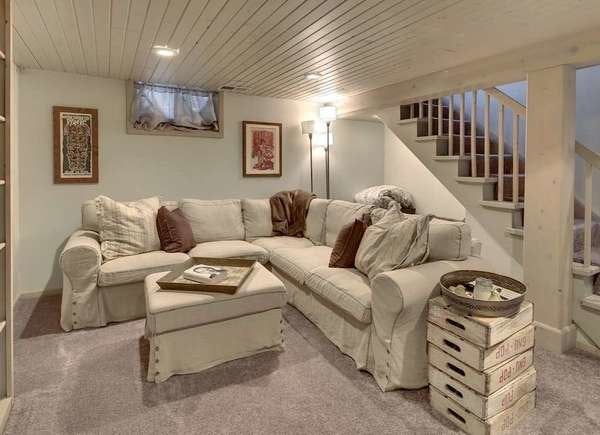 Basement with white shiplap ceiling