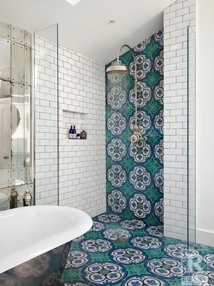 Doorless shower with white subway and blue encaustic shower tile