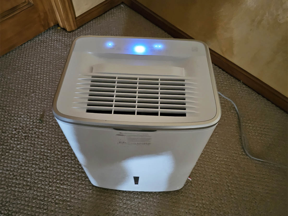 Frigidaire Gallery Dehumidifier in use in a large finished basement