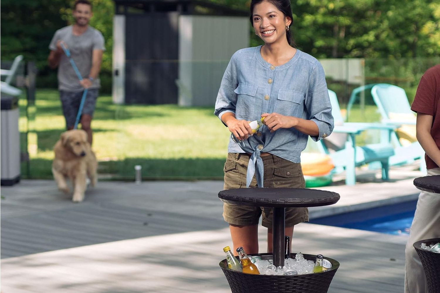 a woman standing by a Keter Pacific Cool Bar