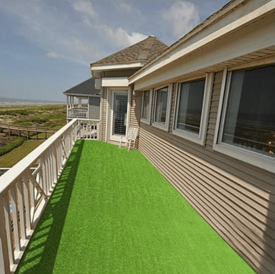 Patio with fake grass on the ground
