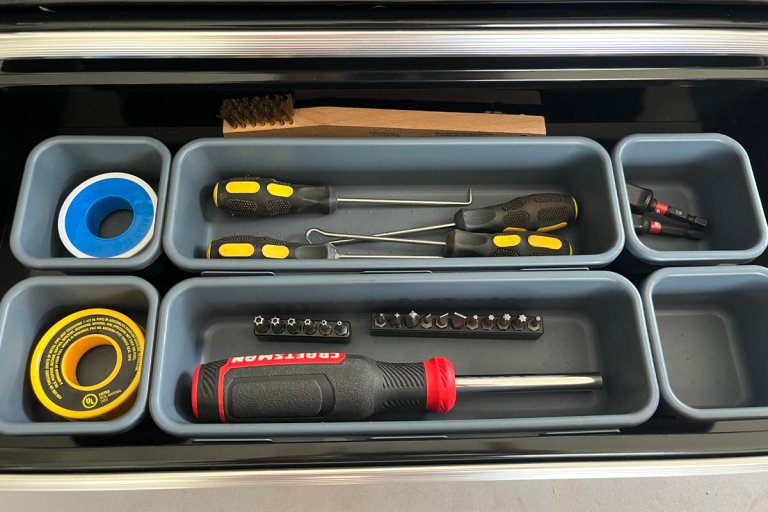 KeFanta tool box organizer trays inside a tool box holding screwdrivers, screws and tape