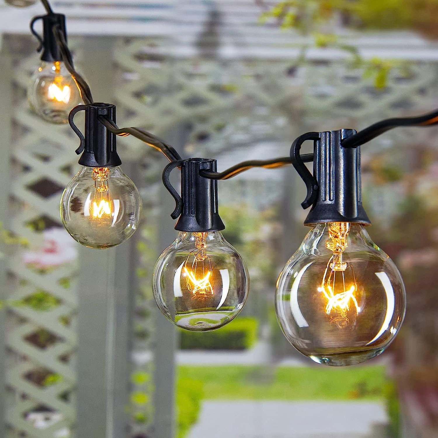 close up on bulbs of string lights in garden