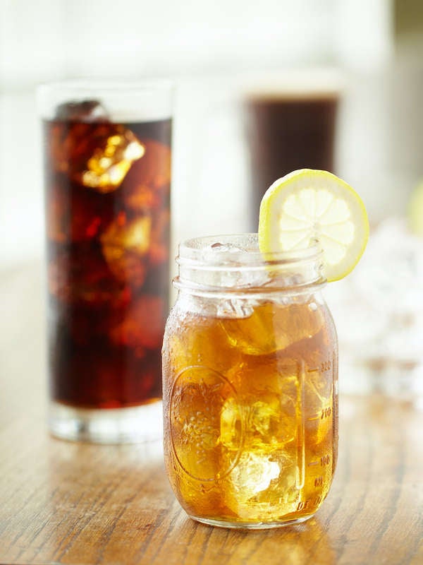 mason jar of iced tea and glass of soda