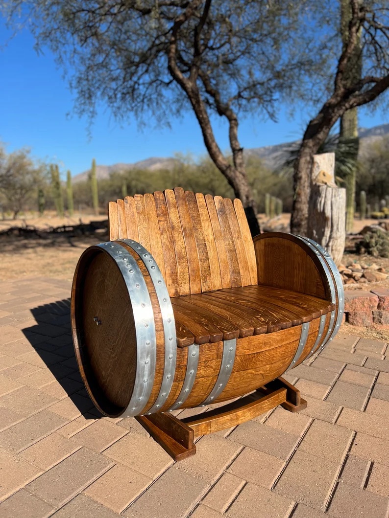 Garden bench crafted out of an old. barrel.