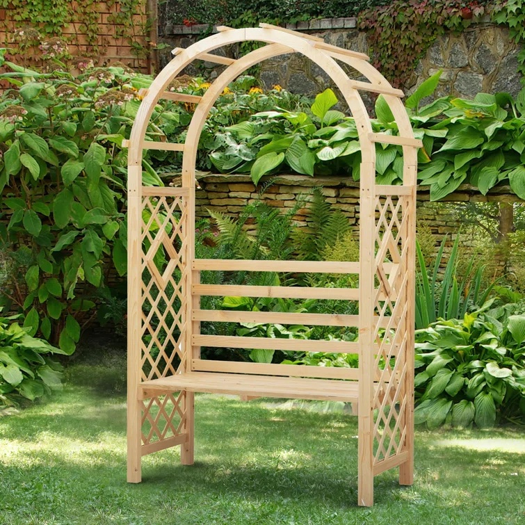 Arbor garden bench with arch and surrounded by garden plants.