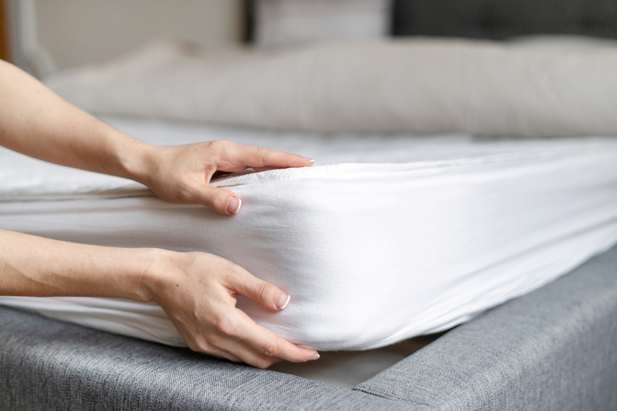 Person holding mattress