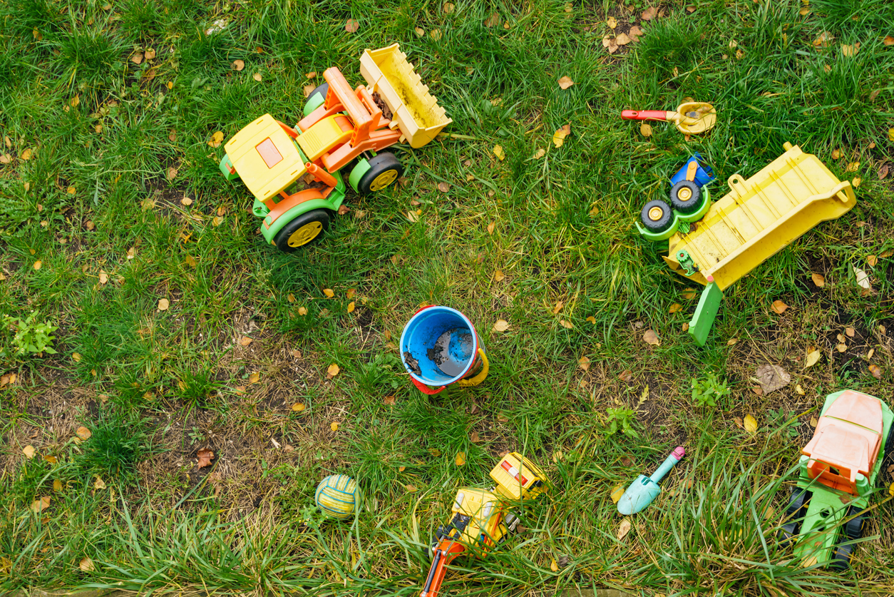 overhead view of childrens toys on grass