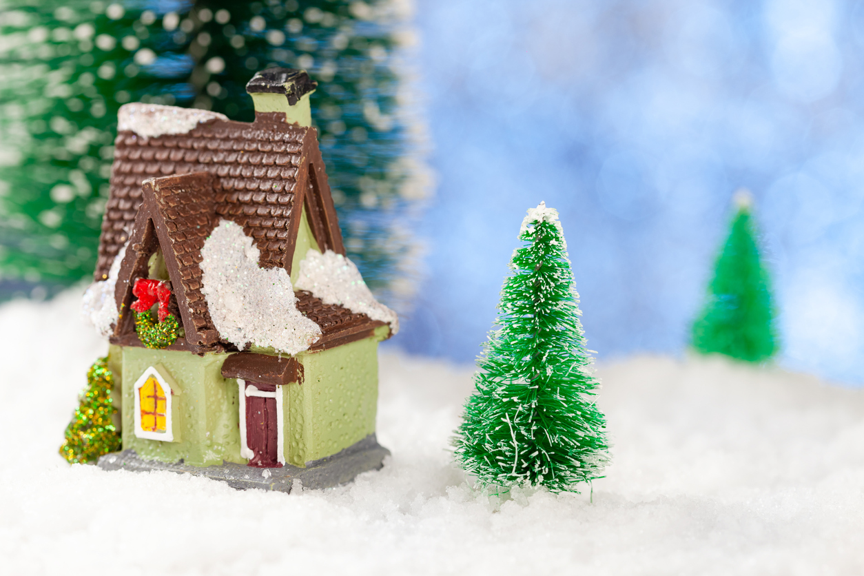 Toy house in the snow, New Year's greeting card. Copy space, concept.