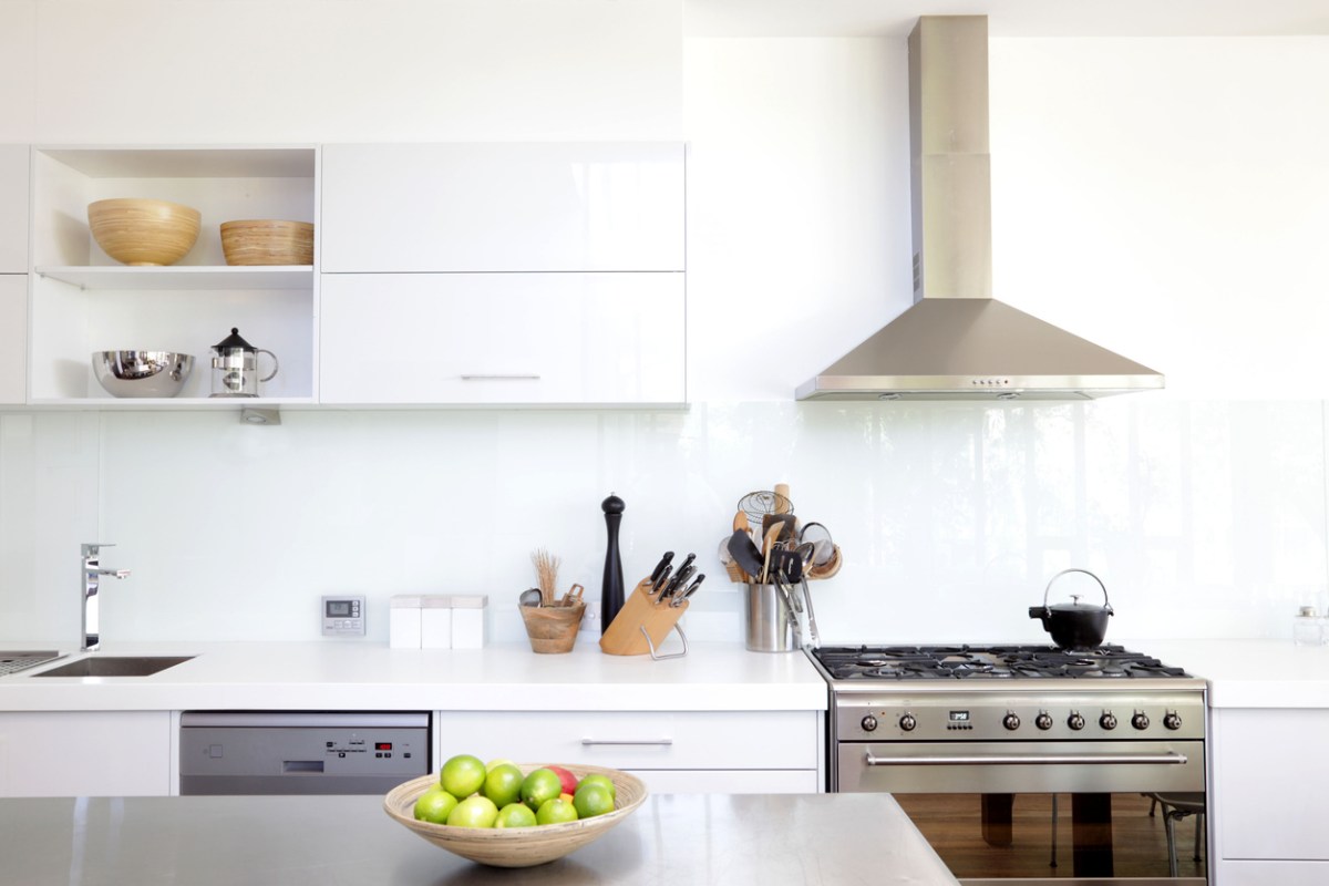 white-kitchen-with-stainless-steel-range-and-range-hood