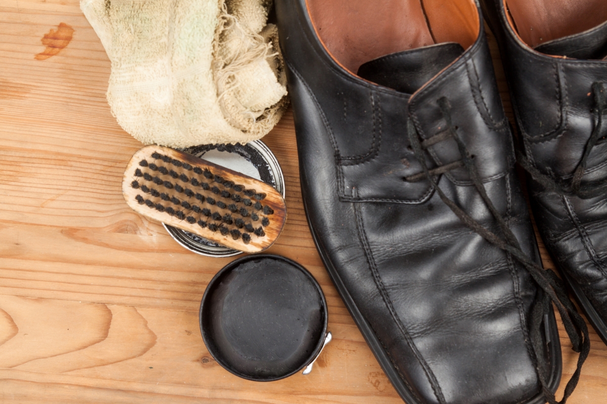 Black shoe polish next to black shoes