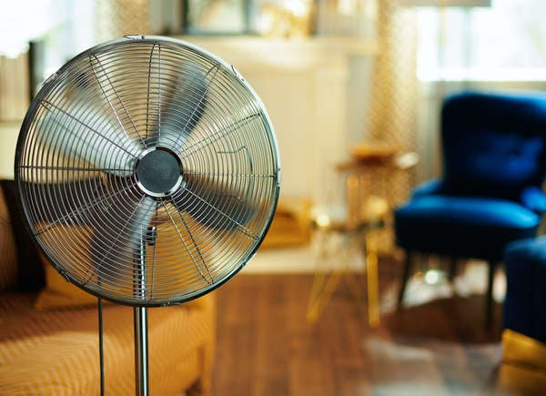 Stand up fan in living room of house