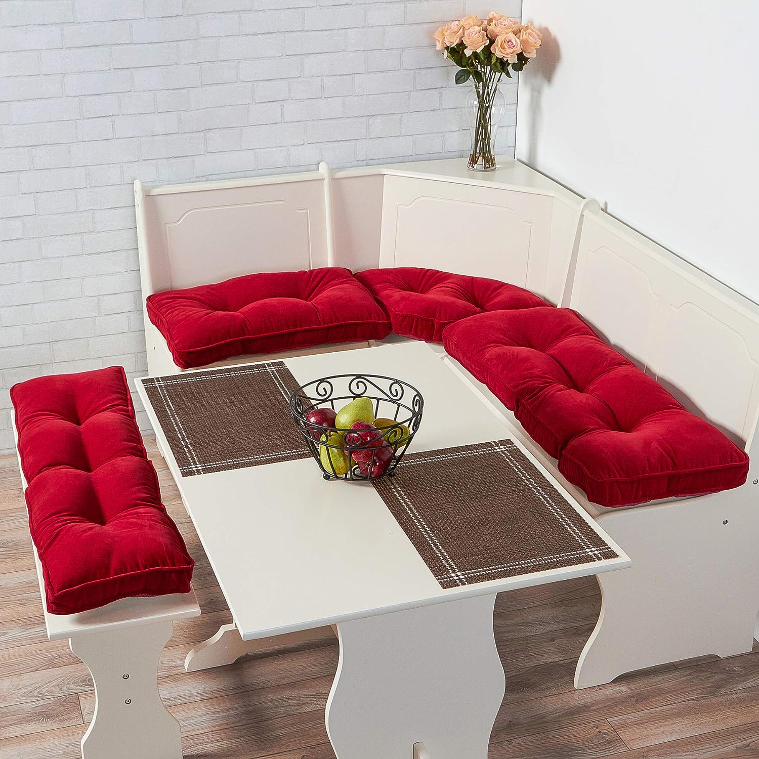 White breakfast nook with red cushions