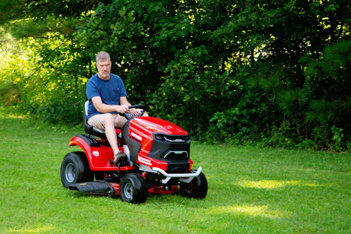 A person mowing a large lawn using the Craftsman Battery Riding mower