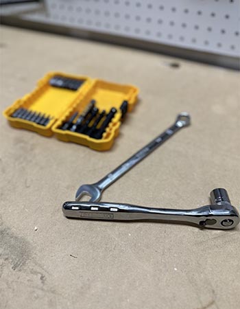 Part of the DeWalt mechanics tools set open on a workbench