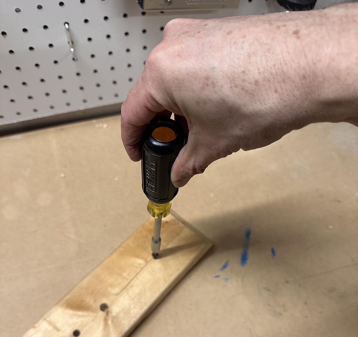 A person using a tool from the DeWalt mechanics tool set