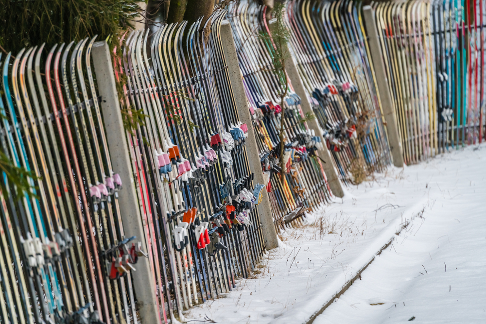 Fence made of colorful disposed of skis,