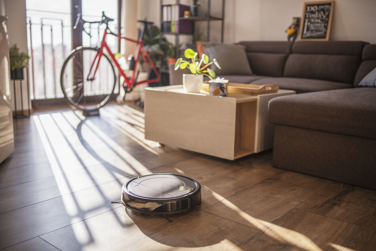The best cheap robot vacuum option in use on a hardwood floor in a small living room