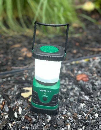 The Lepro LED lantern on a rocky spot in the woods