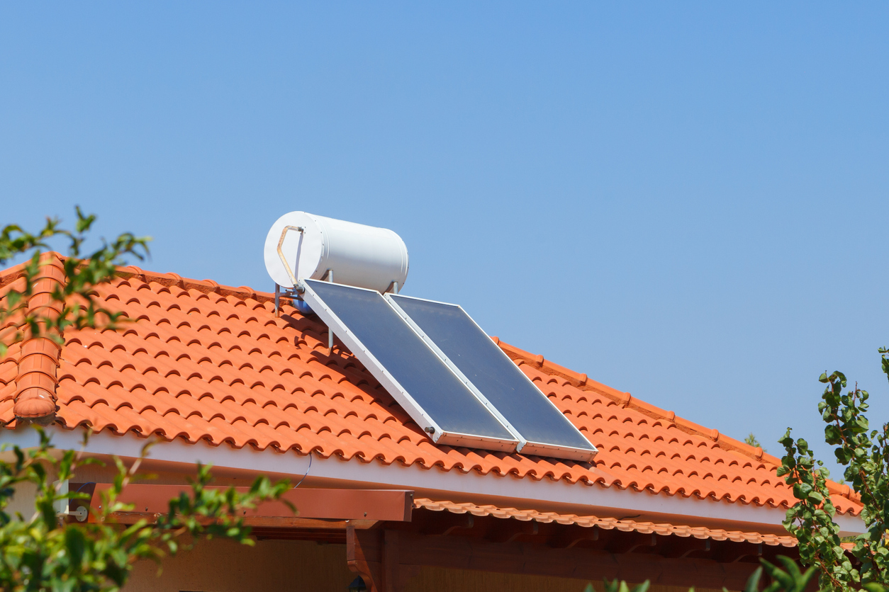 orange roof top with solar panel and water heater