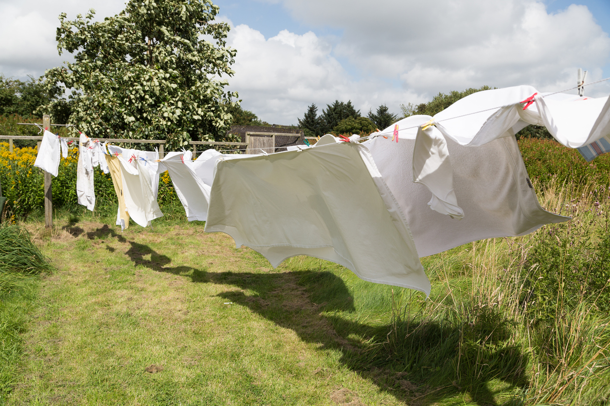 bed linen drying on a clothes line in the garden