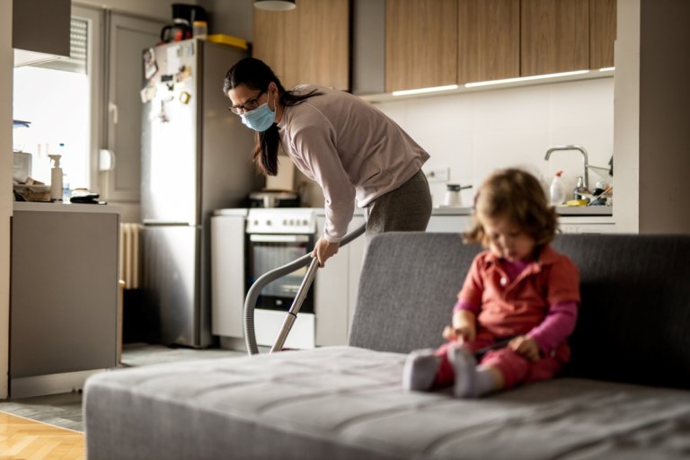 Mom cleaning with mask on
