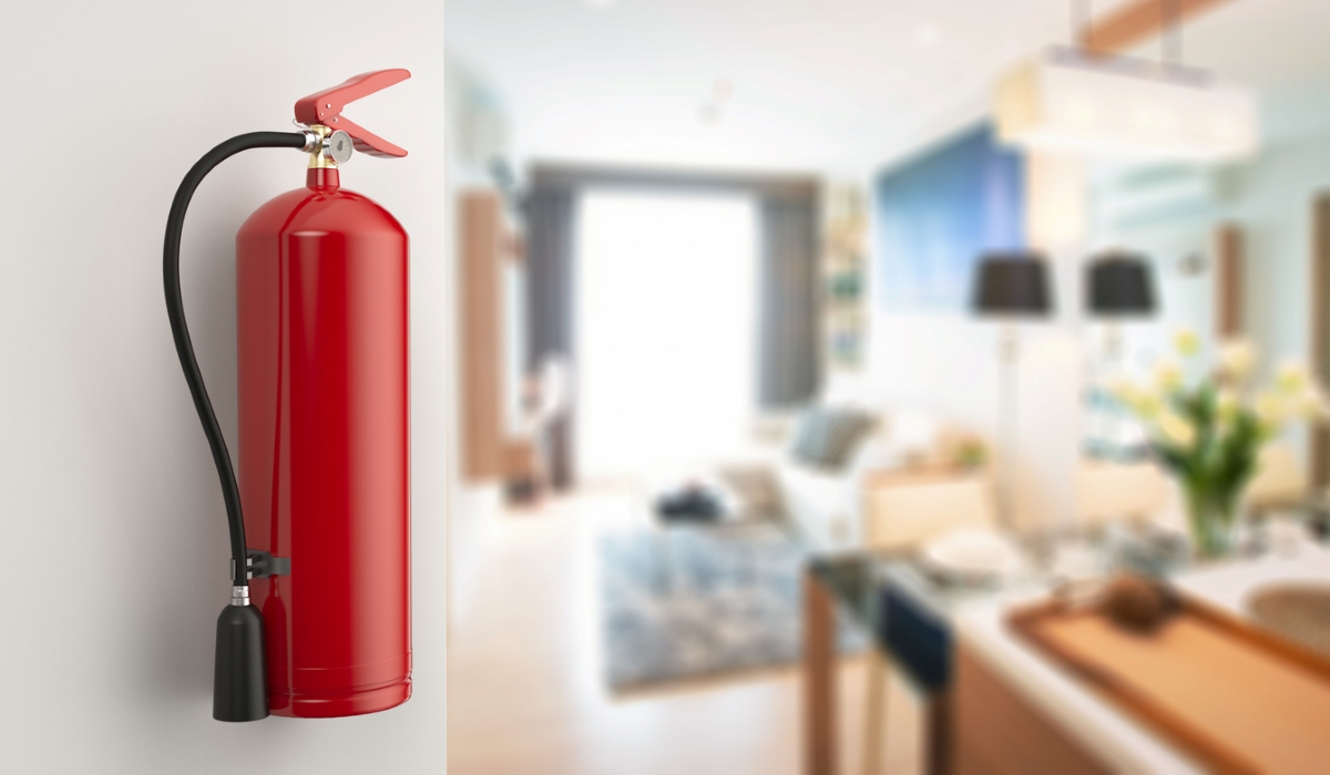 fire extinguisher hanging on wall at home