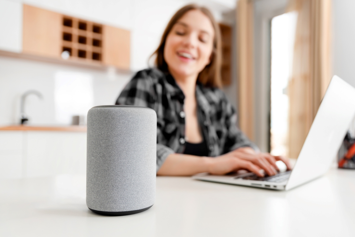 Woman using smart digital assistant