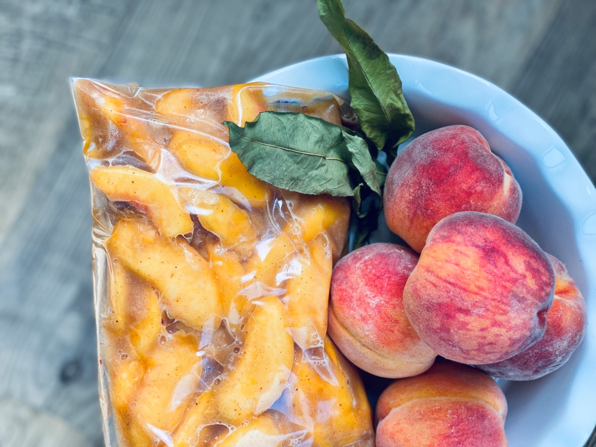 Frozen peaches next to whole peaches
