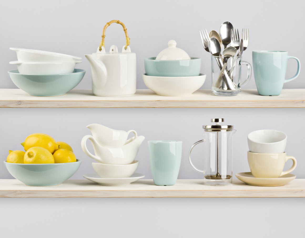 open-shelving-with-white-and-blue-dishware-and-a-tea-pot-and-lemons