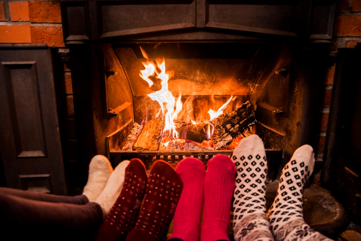 Family warming their feet with socks on