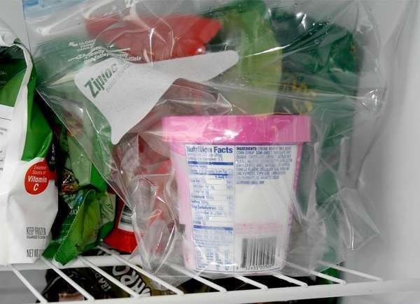 Pint of ice cream in plastic bag in freezer