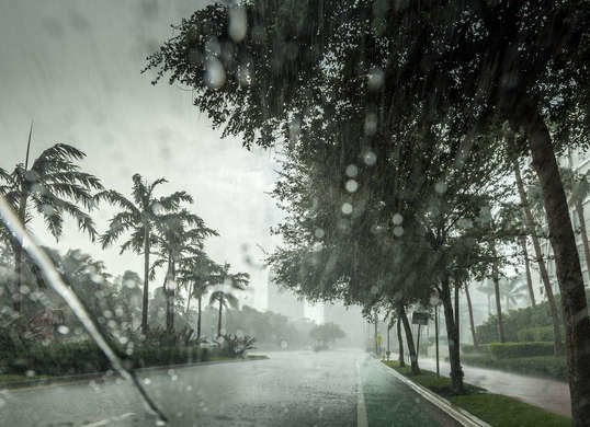 Hurricane rain and wind viewed through a car window