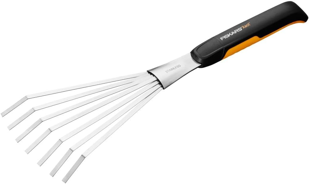 Fiskars Xact Hand Garden Rake with black and orange handle and sliver rake.