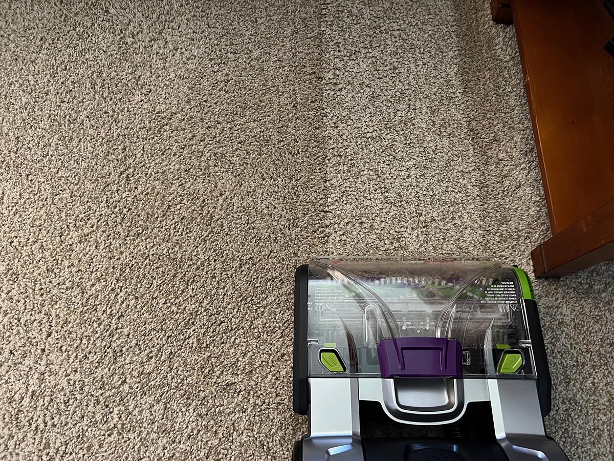 Bissell ProHeat 2X Revolution Pet Pro removing dirt stains from beige carpet after one pass.