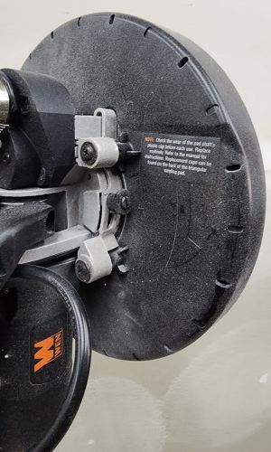 A close up of the circular head on the Wen drywall sander
