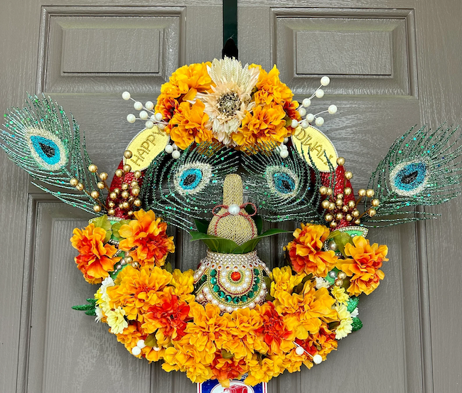 diwali-front-door-wreath-with-marigolds-and-peacock-feathers