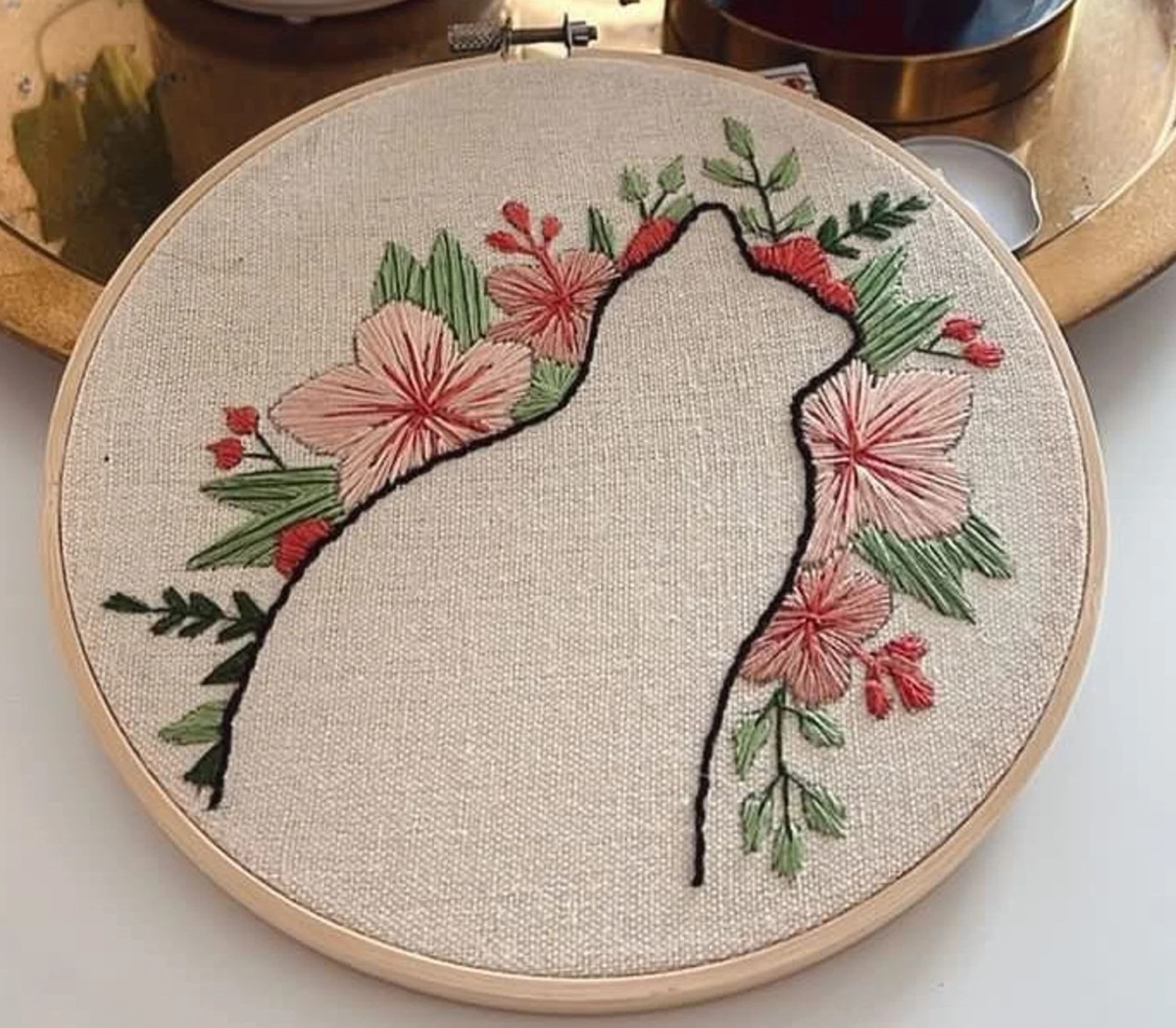 Embroidered cat silhouette with flowers
