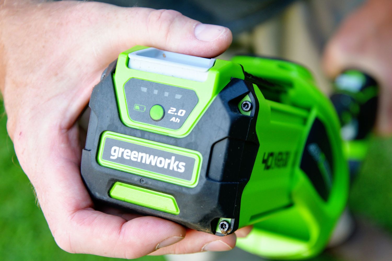 A close-up of the battery on the Greenworks 40V cordless pole saw