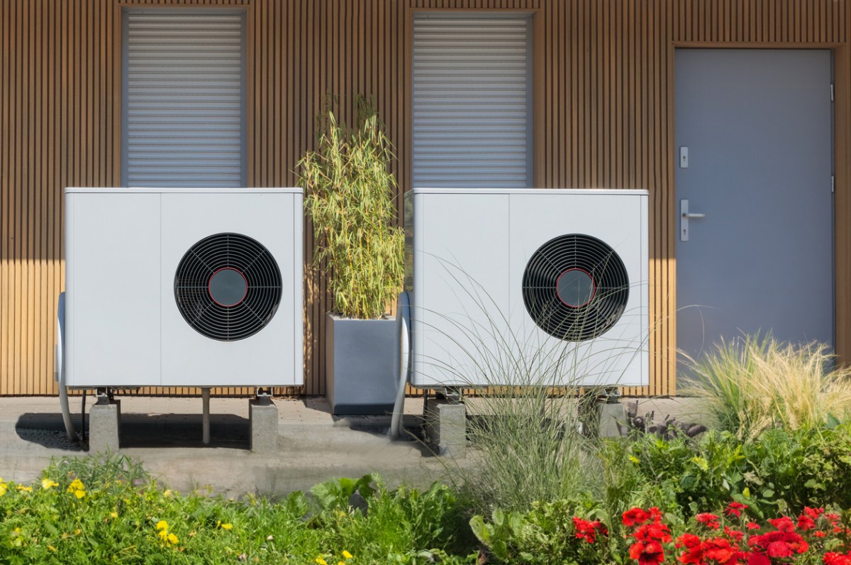 A view of two heat pumps outside.